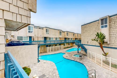 a view of a swimming pool in a apartment complex at Hale I'a in Carpinteria