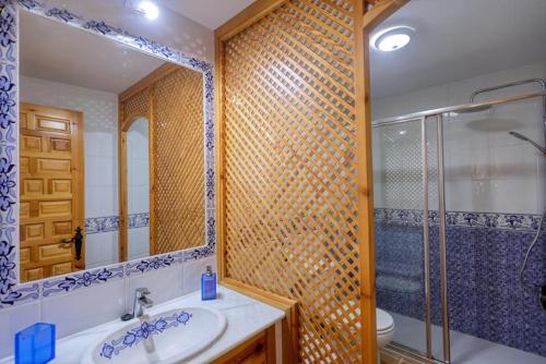 a bathroom with a toilet and a sink and a shower at Apartamento Atlanterra Playa in Zahara de los Atunes
