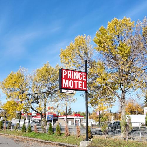 a purchase motel sign on the side of a street at Prince Motel in Prince George