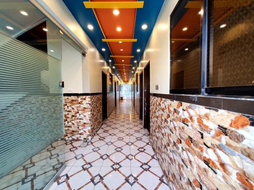 a corridor of a building with a hallway at Diplomat Inn Hotel in Karachi