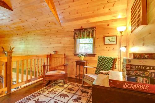 a living room of a log cabin at The Locke-ness Pond Cabin in Chesterville! in Wilton