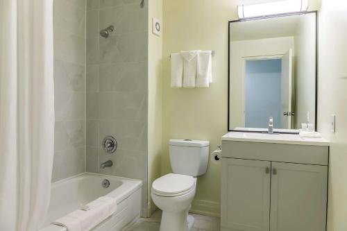 a bathroom with a toilet and a sink and a shower at Motel 6 Niagara Falls, ON Near the Falls in Niagara Falls
