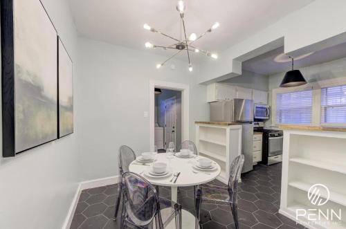 a kitchen and dining room with a table and chairs at Relaxing Retreat in Memphis Apartment in Memphis