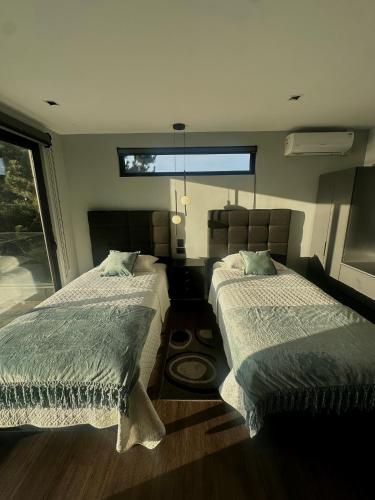 Postel nebo postele na pokoji v ubytování Seaside House Pichilemu