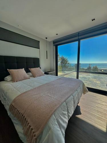Postel nebo postele na pokoji v ubytování Seaside House Pichilemu