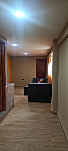a living room with a couch and chairs in it at casa de campo in Ibarra
