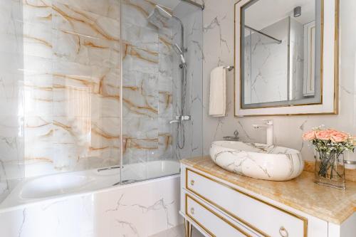 a bathroom with a tub and a sink at Dreamy Luxury Apartment in Tashkent