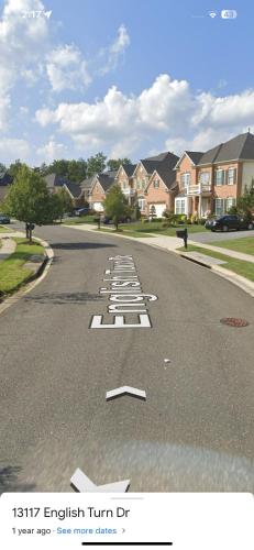 a view of a street with houses in the background at Pleasant, Enjoyable and Relaxing, Lower Level in Silver Spring