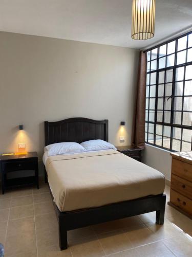 Ένα ή περισσότερα κρεβάτια σε δωμάτιο στο Hostel Inn