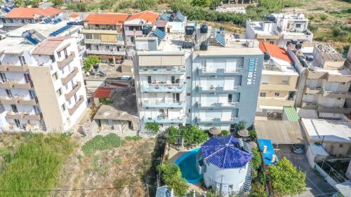 an overhead view of buildings in a city at RODI BLUE apartments in Amoudara Herakliou