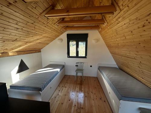 a room with two beds and a window at Vita Abies in Vodice