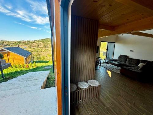 a living room with a couch and a large window at Vita Abies in Vodice