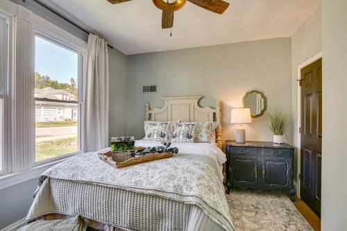 a bedroom with a bed and a window at Vino Villa Wine Country Gem Patio and Grill in Defiance