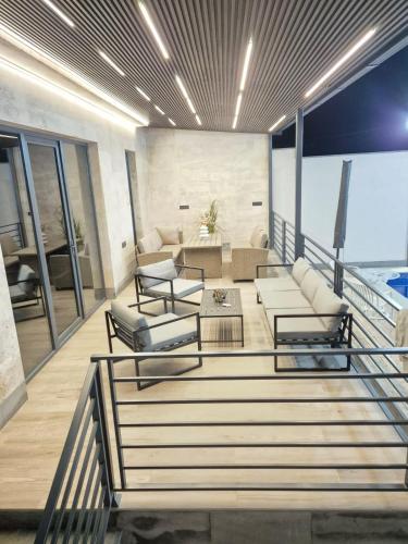 a living room with a couch and a table at Elite Home in Yerevan