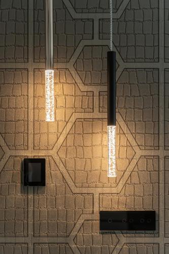 a room with two lights hanging from a brick wall at Your Holidays Waves in Międzyzdroje
