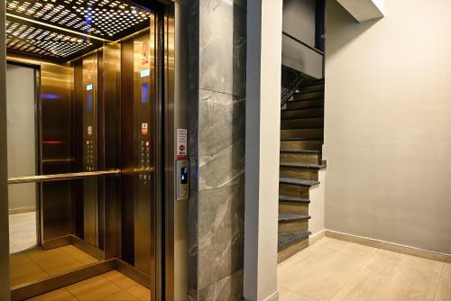 a elevator in a building with a glass door at Central Studio Apartments by Parkside Boutique in Skopje