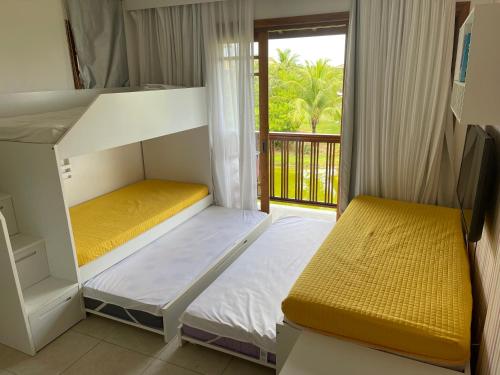 Ένα ή περισσότερα κρεβάτια σε δωμάτιο στο Comodidade, conforto e charme, á beira mar!