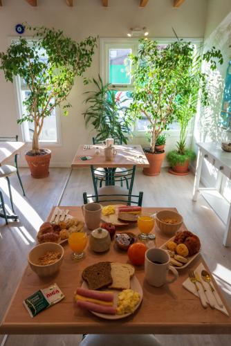 a table full of breakfast foods on a table at Los Calafates Hotel in Ushuaia