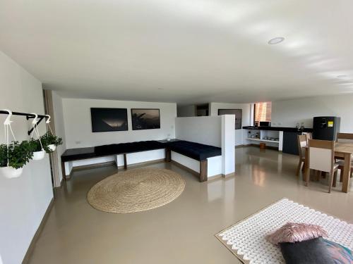 a living room with a couch and a table at Ope Suites calle 100 in Bogotá