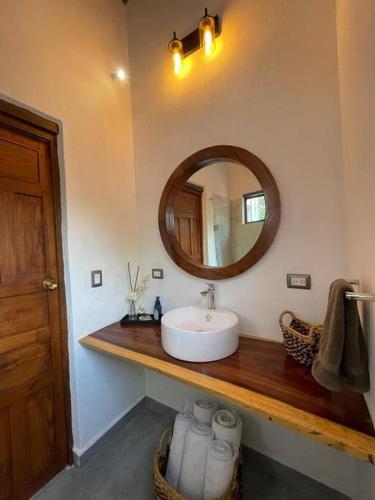 a bathroom with a sink and a mirror at Casa Moly in Guanajuato