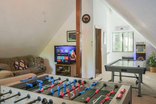 a living room with a ping pong table at Evergreen Dorrington Chalet - Family Fun & Game Rm in Dorrington