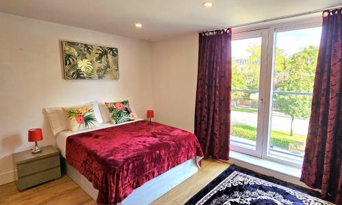 a bedroom with a bed and a large window at Grace Studio in London