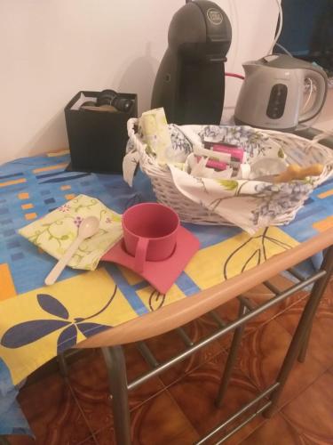 a table with a basket and other items on it at Agriturismo la Terra di Mezzo in Castellamonte