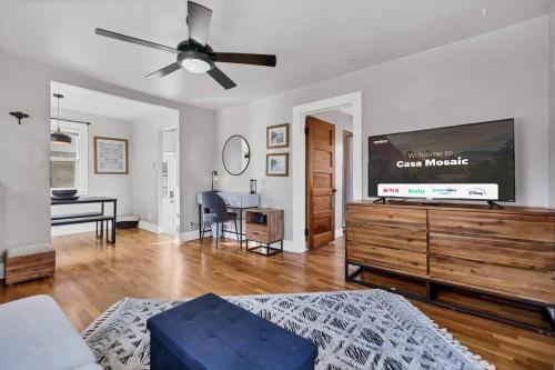 a living room with a couch and a ceiling fan at Casa Mosaic Executive Rental 3bedroom Smart TV in Colorado Springs