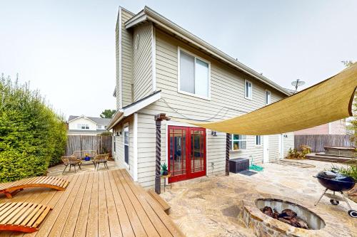 a house with a wooden deck with a fire pit at Victorian Dream in Arroyo Grande