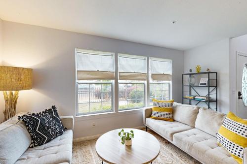 a living room with two couches and a table at Victorian Dream in Arroyo Grande