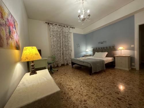 a bedroom with a bed and a lamp in it at Opera in Love in Verona