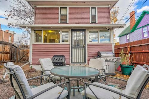 a patio with chairs and a table in front of a house at Tiger Lair Walk to CC Historic Downtown COS 4BR in Colorado Springs