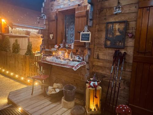 a wooden house with a counter with lights on it at LE BLANC NORDIQUE in Le Bouchet-Mont Charvin