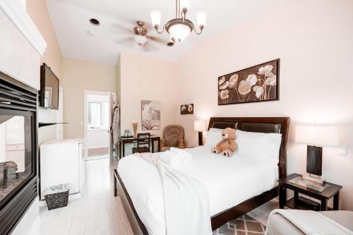 a bedroom with a bed with a stuffed animal on it at Along River Ridge in Calgary
