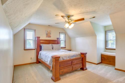 a bedroom with a bed and a ceiling fan at House on 20 Acres with On-Site Pond in Spring Lake! in Spring Lake