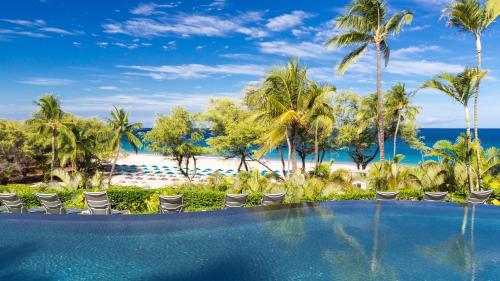 a view of the beach from the pool at the resort at ❤PiH❤ Hapuna Surfside Beachfront Steps From Ocean B26 in Hapuna Beach
