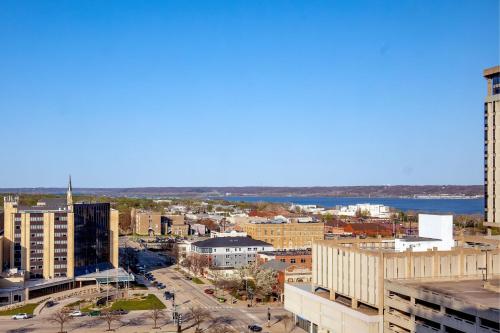 an aerial view of a city with a river and buildings at Peoria Marriott Pere Marquette in Peoria