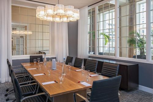 a conference room with a long table and chairs at Peoria Marriott Pere Marquette in Peoria