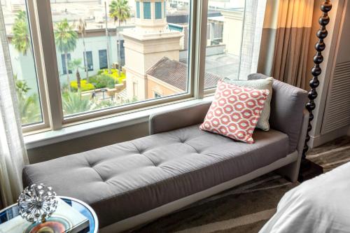 a couch in a room with a large window at Renaissance Tampa International Plaza Hotel in Tampa
