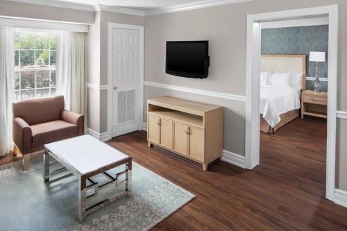 a hotel room with a bed and a television at Residence Inn by Marriott West Orange in West Orange