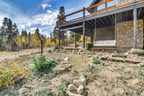 a house with a garden in front of it at Spacious Black Hawk Home with Deck and Mountain Views! in Black Hawk