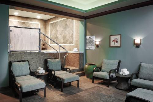 a waiting room with chairs and a stair case at Renaissance Montgomery Hotel & Spa at the Convention Center in Montgomery