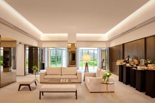 a living room with a couch and a table at Penha Longa Resort in Sintra