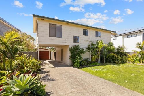 a house with a driveway in front of it at Leura on Ophir in Ventnor