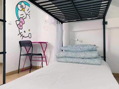 a bedroom with a bed with a painting on the wall at Rainbow Villa, One bed in shared dormitory room, please choose male or female room correctly, not mixed, check in from 16h00 to 23h50 in Villejuif
