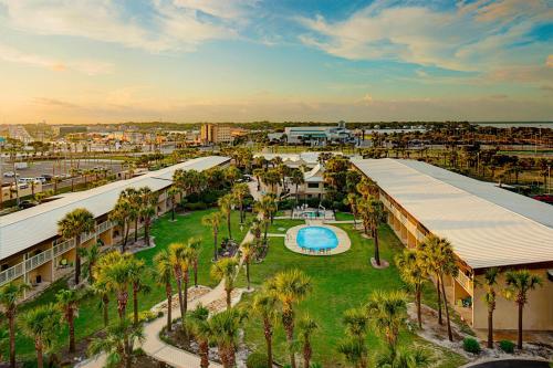 an aerial view of a resort with a pool and palm trees at Four Points by Sheraton Destin - Fort Walton Beach in Fort Walton Beach