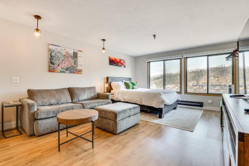 a living room with a couch and a bed at Walk to Dtwn Winter Park Studio with Hot Tub Access in Winter Park