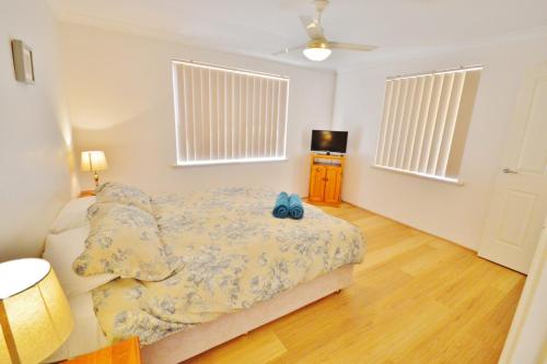 Ένα ή περισσότερα κρεβάτια σε δωμάτιο στο Surfside Retreat - Kalbarri, WA