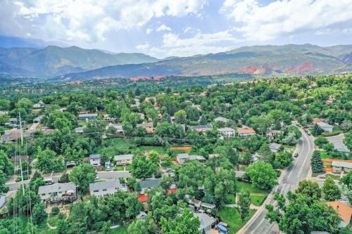 an aerial view of a small town with mountains at Runaway Escapade! Hot Tub, BBQ & Fire Pit in Colorado Springs