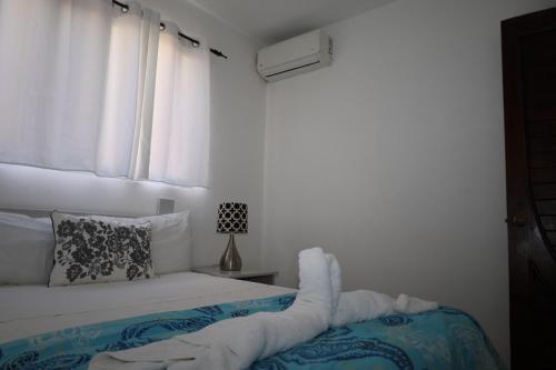 Ένα ή περισσότερα κρεβάτια σε δωμάτιο στο Aparta-Hotel Villa Baya